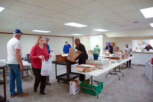 Volunteer packing gift boxes