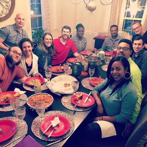 Diverse group of people around a dinner table