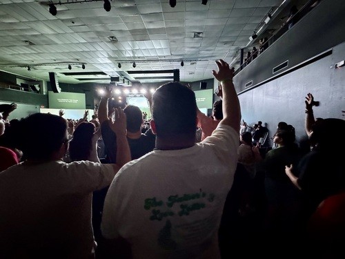Students worshiping on a Wednesday night