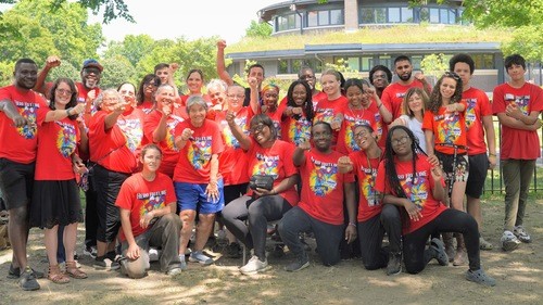 Volunteers and kids at Brooklyn Vacation Bible School smiling together