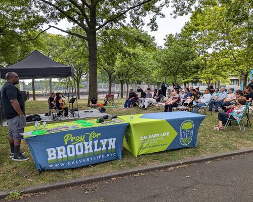 Kids choosing small prizes from the Vacation Bible School reward table after completing activities.