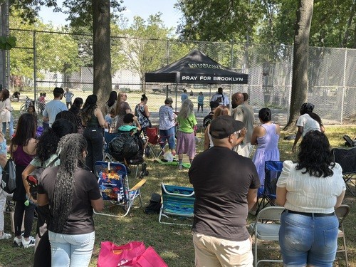 Volunteers and kids at Brooklyn Vacation Bible School smiling together