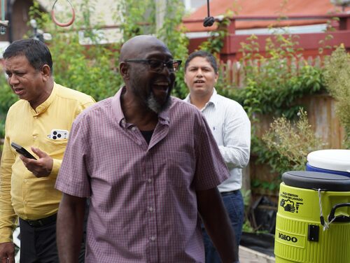 Calvary Life neighbors talking at a backyard gathering in Brooklyn