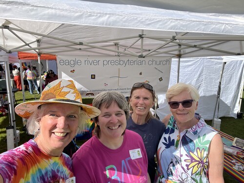 Four volunteers at Pride in the Park