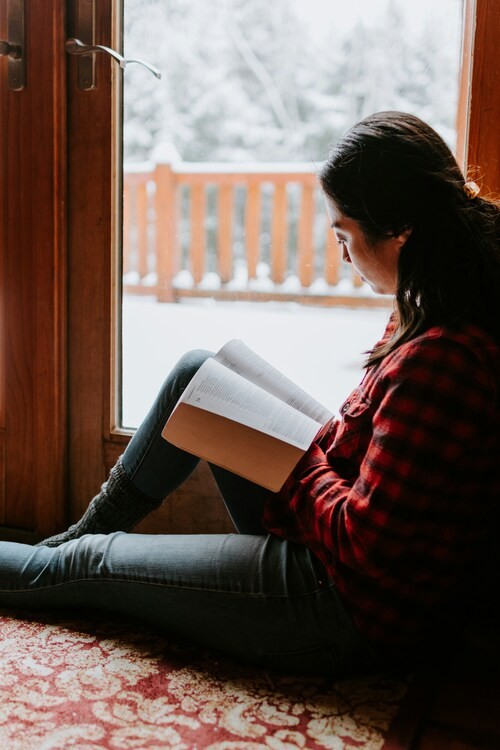 Woman studying Bible at home