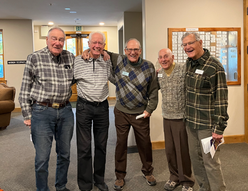 Group of senior men who serve as greeters