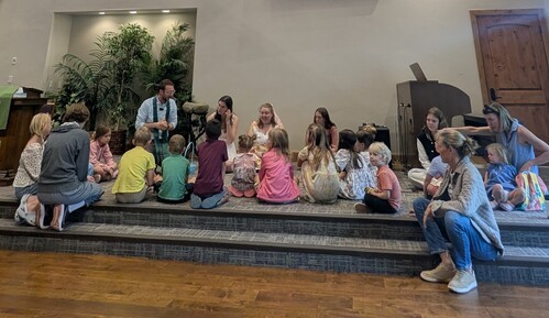 Group of children listening to children's message