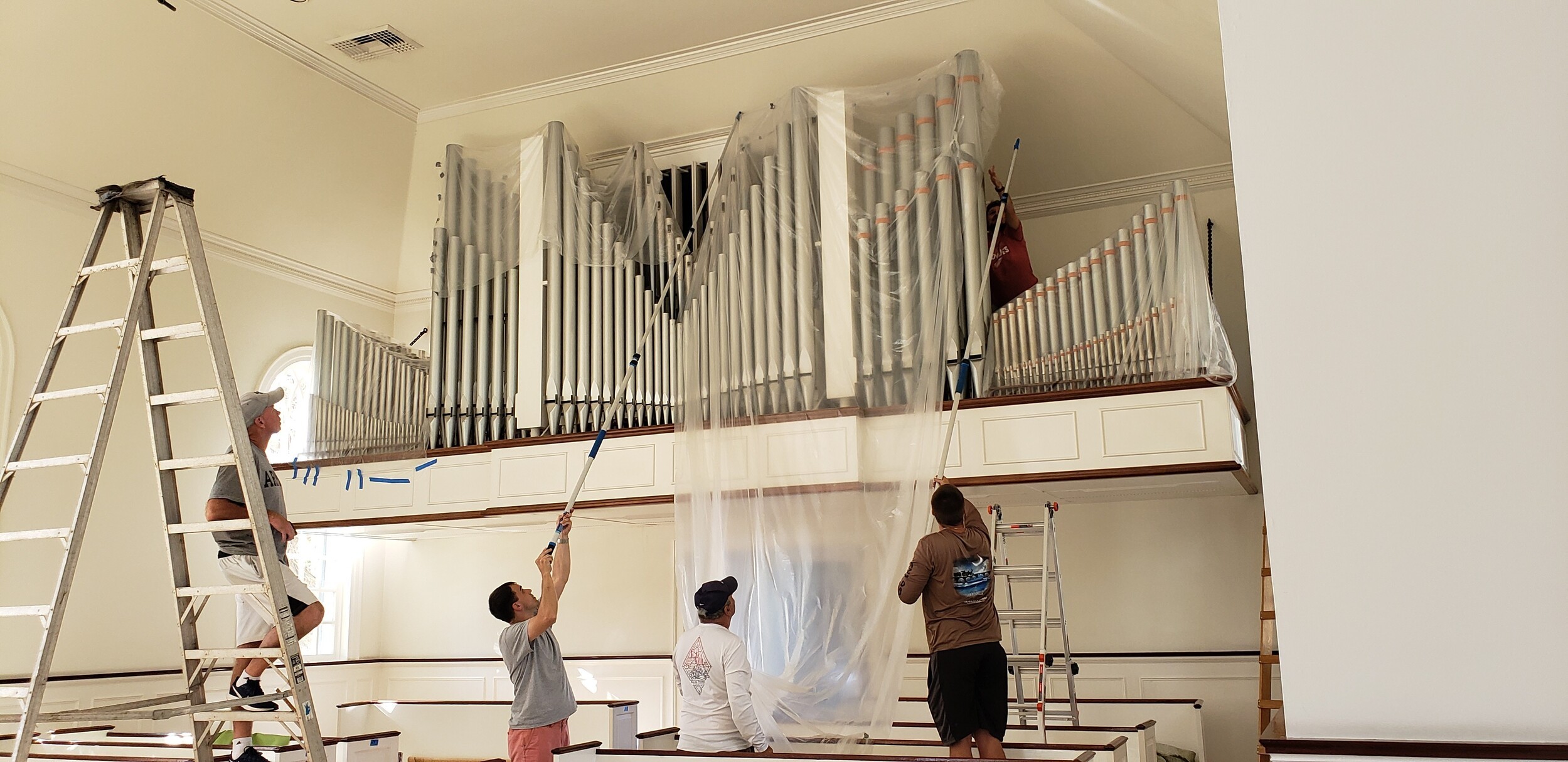 Organ pipes being protected during recovery work following Hurricane Ian