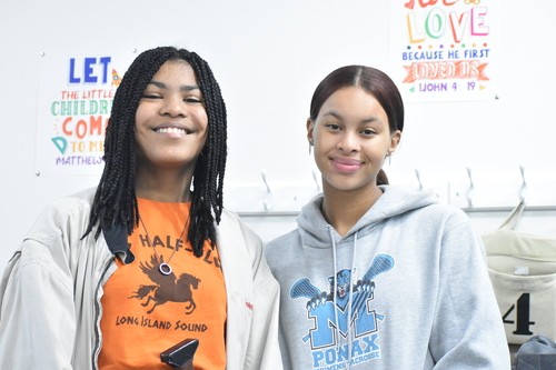 Two young women smiling to the camera at Crossroads Church