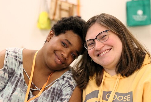 Two women working together to enjoy church in Virginia