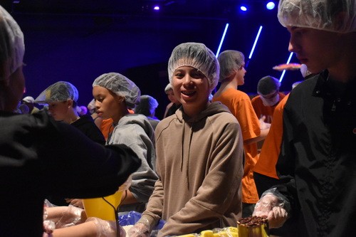 Students working at a food bank to help others in Fredericksburg Virginia