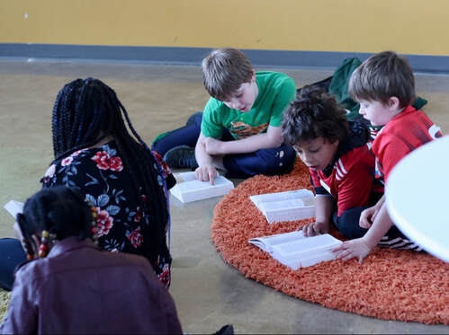 Children reading the bible at sunday school at Crossroads Church