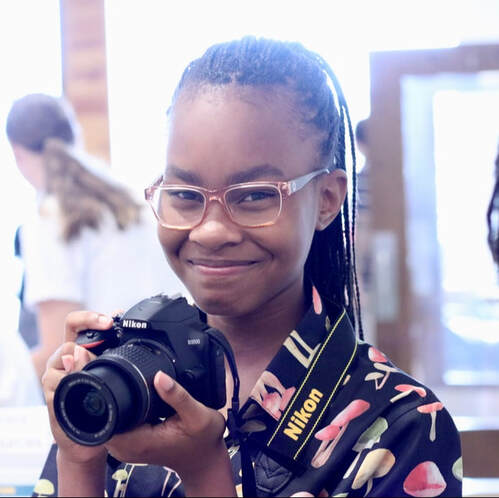 Student taking photography of church members at Crossroads Church VA 