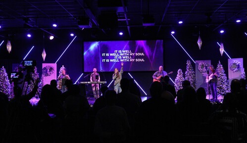 Joel and Christina talking to church congregation in Fredericksburg Virginia