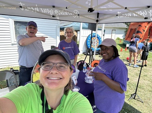 photo of backpacks filled with school supplies we give away each summer at the Hope Rocks festival