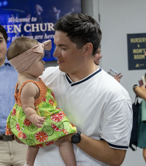 Volunteer holding a baby at Awaken Church in Round Rock, TX