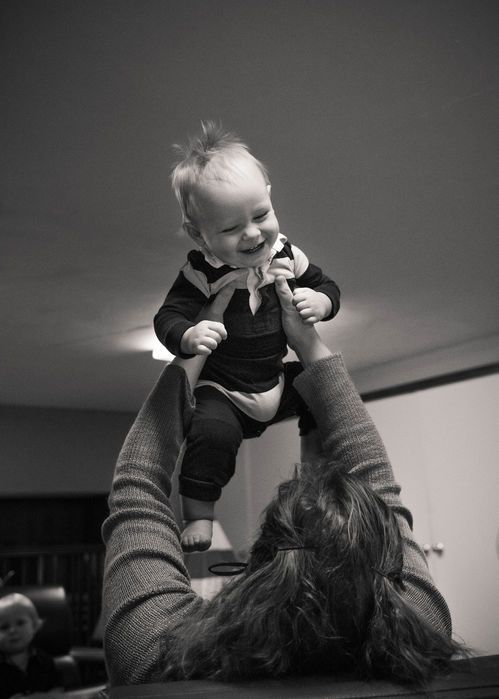 Woman holding up a baby