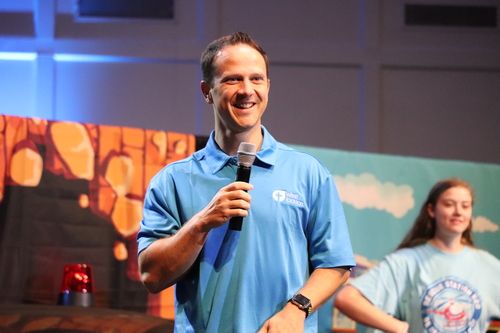Bro. Austin Kimbrough smiling with microphone