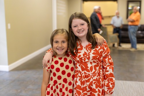 two girls with arms around each other