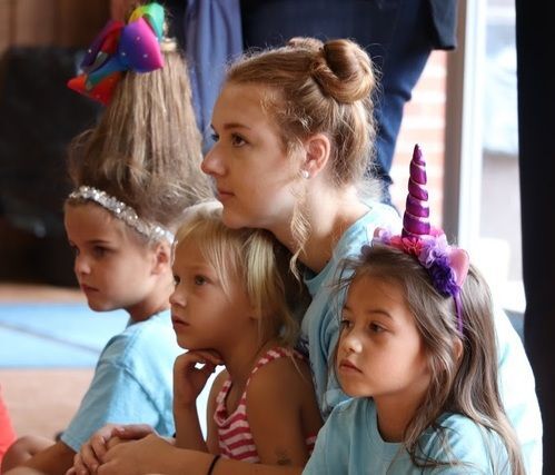 little girls listening to Bible story