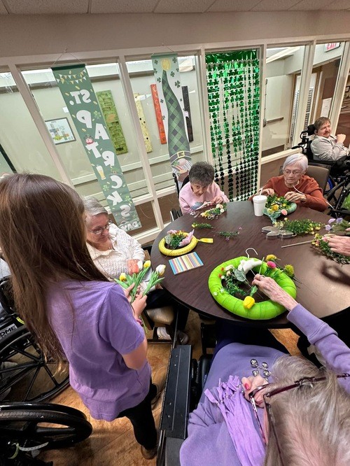 girl helping nursing home residents