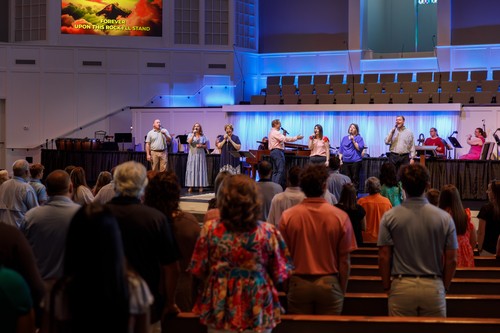 vocal team on stage leading worship