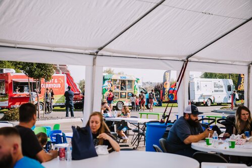 Food trucks and a tent at the Southridge community open house
