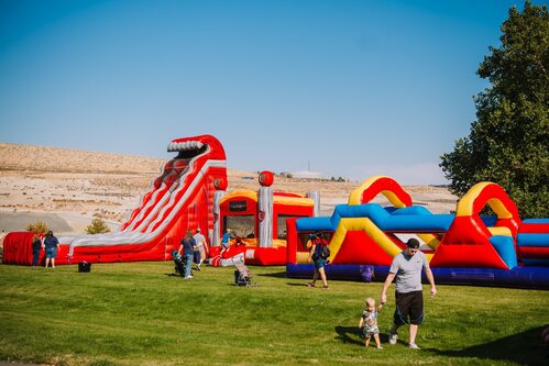 Inflatable slide and bounce houses at the Southridge community open house