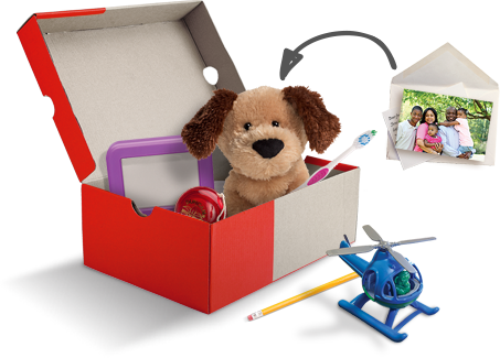 A shoebox with toys, school supplies, and a personal note