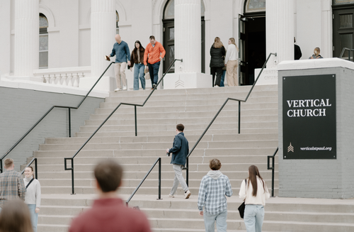 two men hugging outside