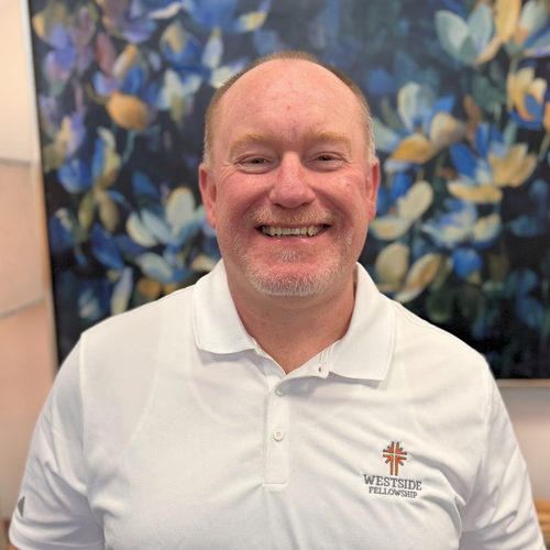 headshot of a pastor with abstract art background