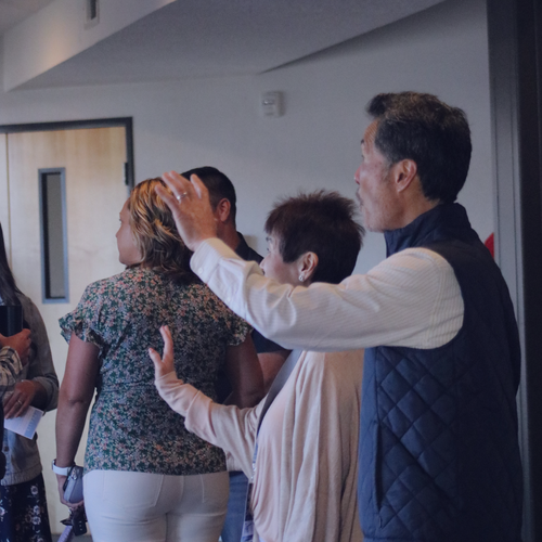 Greeters waiving and welcoming newcomers