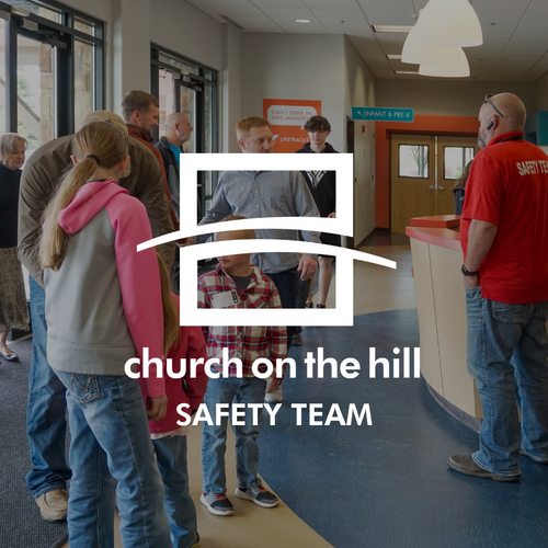 Photo of Safety team members greeting children at Church on the Hill