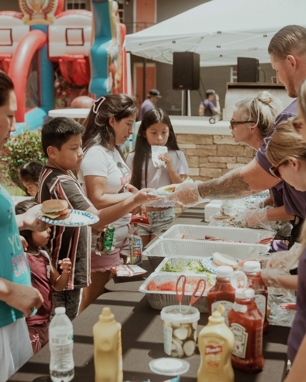 A Mountain West team serving plates of food to families on a mission trip