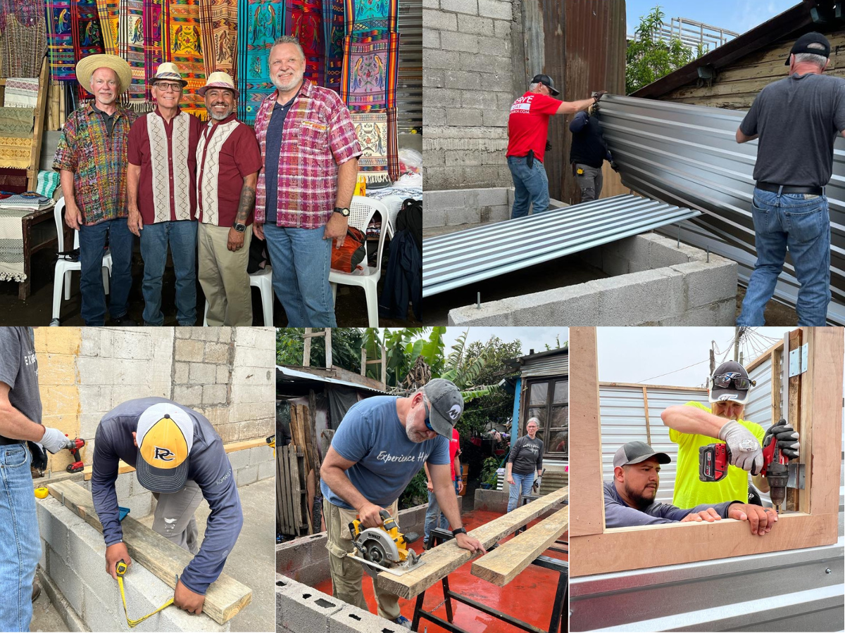 Three men lifting a sheet of corrugated roofing into place in Guatemala