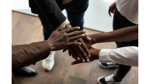 group of men with hand over each hand