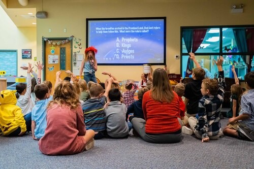 Teacher leading children at Children's Church