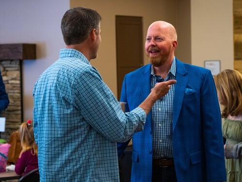 Two men talking to each other