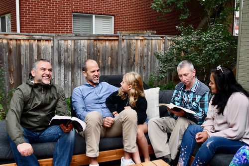 Group of people meeting together outside