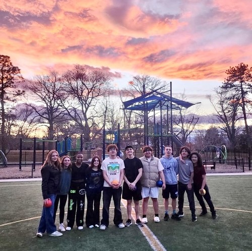 Group of high school students playing a game in the gym