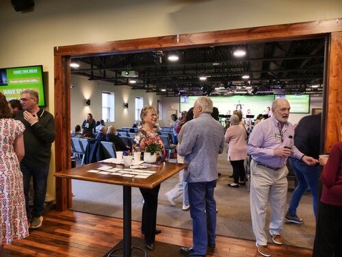Picture of people mingling in a church lobby