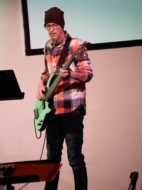 Picture of a man playing base during worship