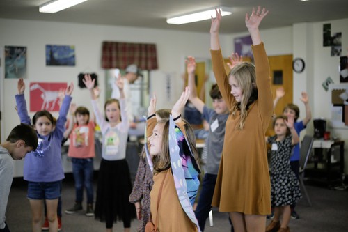 Kids worshipping Jesus