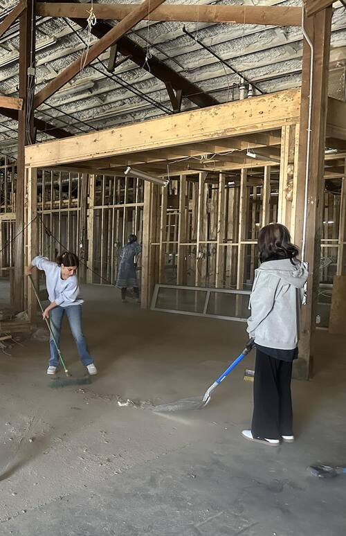 Students cleaning up after Hurricane Helene