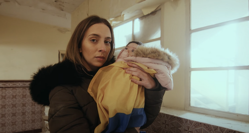 A woman holding a baby