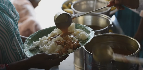 Meal being served to someone in need
