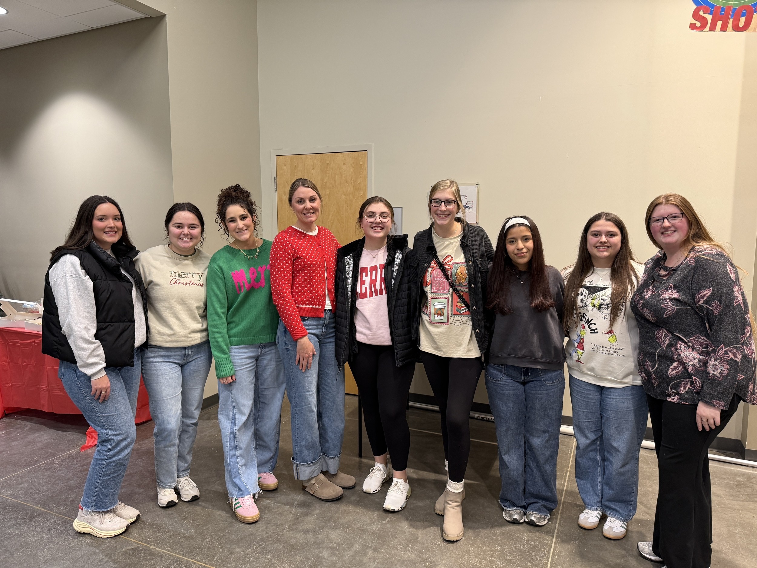 Young adults standing together for a group photo