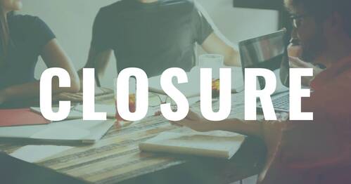 People at a table with Bibles